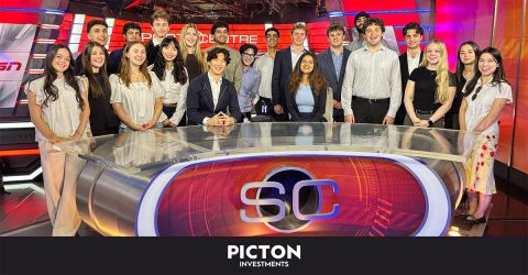 Picton Investments interns gathered around the SportsCentre desk during the TSN office tour